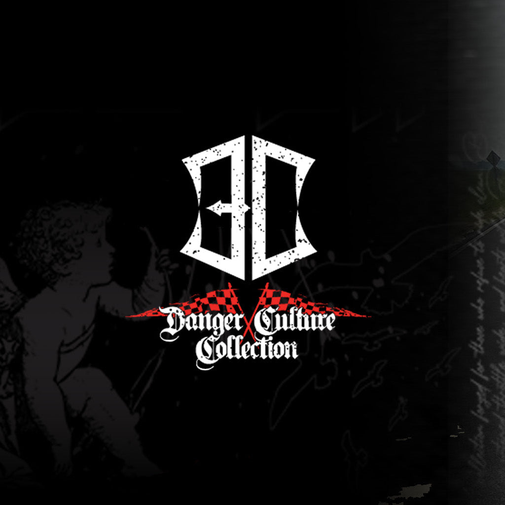 Man wearing a black t-shirt with text and graphics, standing on a road with a 'Danger Culture Collection' logo on the left.